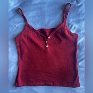 A red button tank top